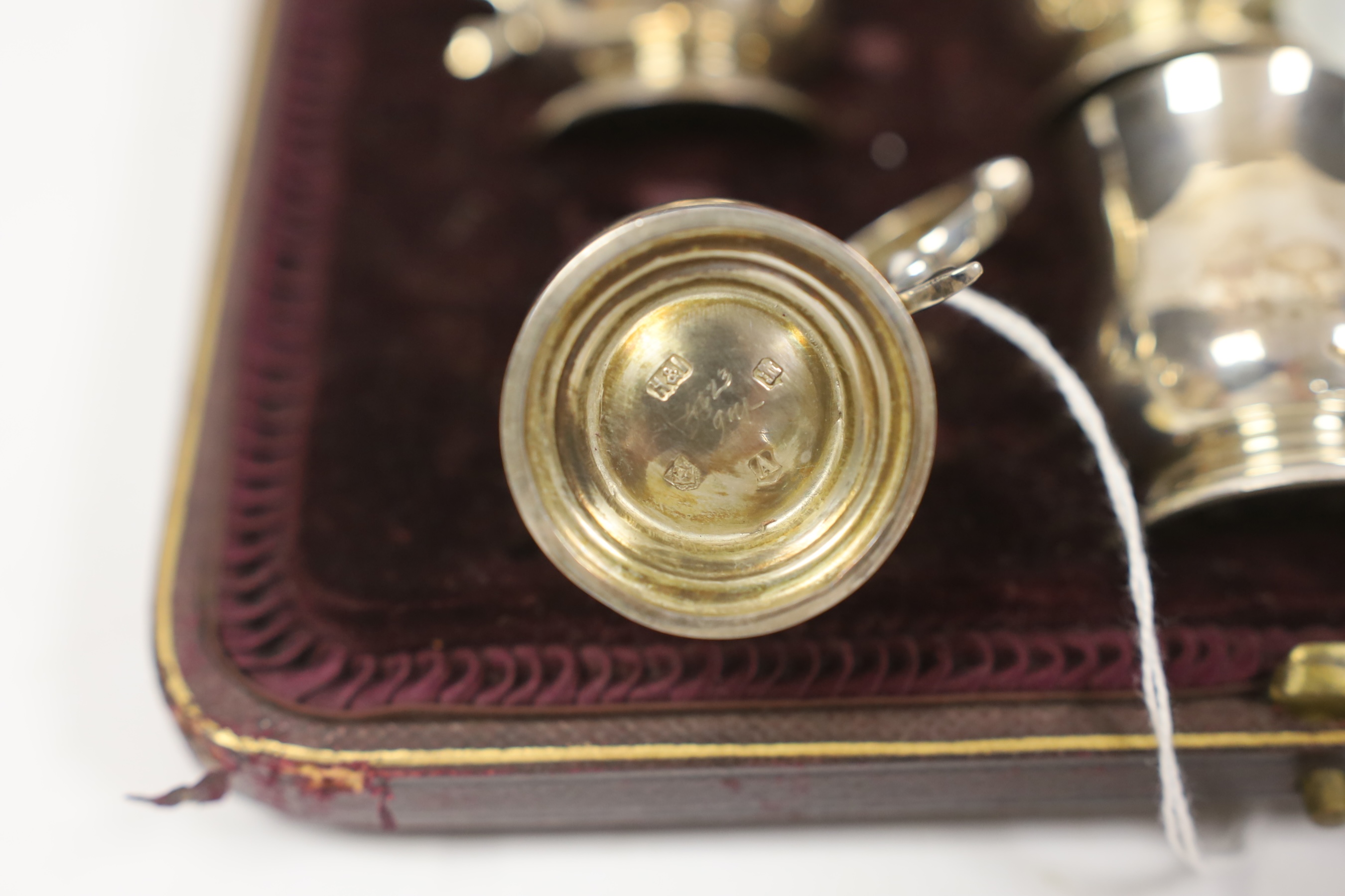 An Edwardian cased set of six miniature baluster mug tots, Hamilton & Inches, Edinburgh, 1906, 49mm.